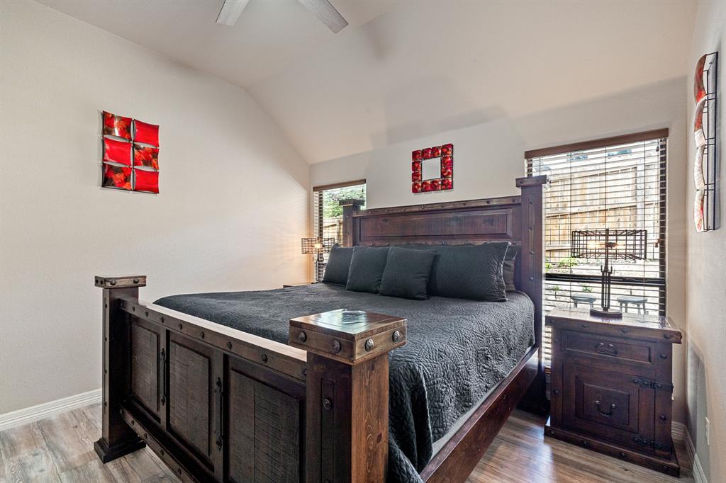 15508 Checotah Drive Austin, TX 78734 - Photo 12 of 23 a bedroom with a bed and a dresser next to a window