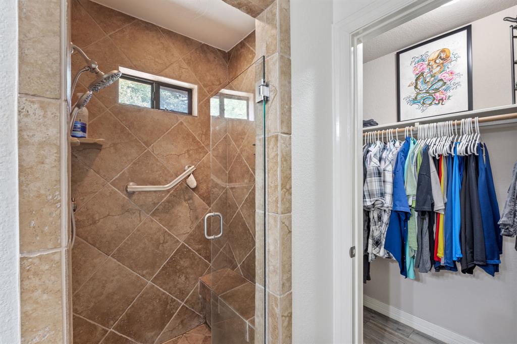 15508 Checotah Drive Austin, TX 78734 - Photo 14 of 23 a view of walk in closet with clothes