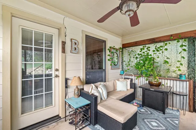a living room with furniture and windows