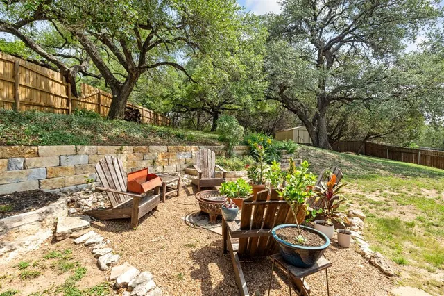 a view of a lounge chair and table in the patio