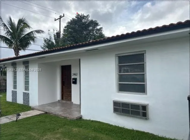 a house view with a garden space