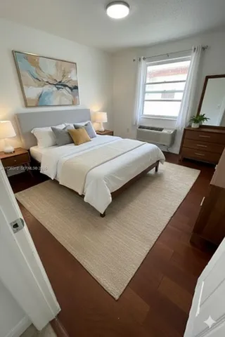 a bedroom with a bed and window