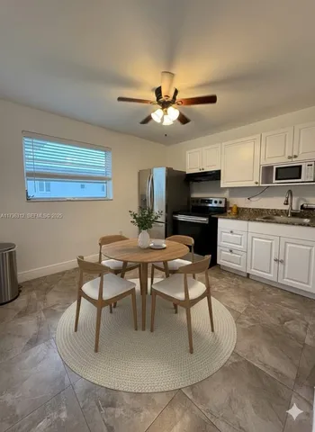 a view of a dining room with furniture