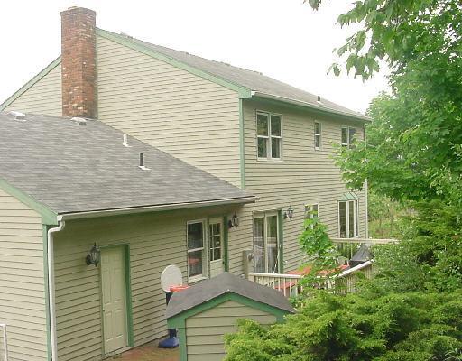 8 Spruce Mountain Road Danbury, CT 06810 - Photo 1 of 1 a view of brick house with large windows and potted plants