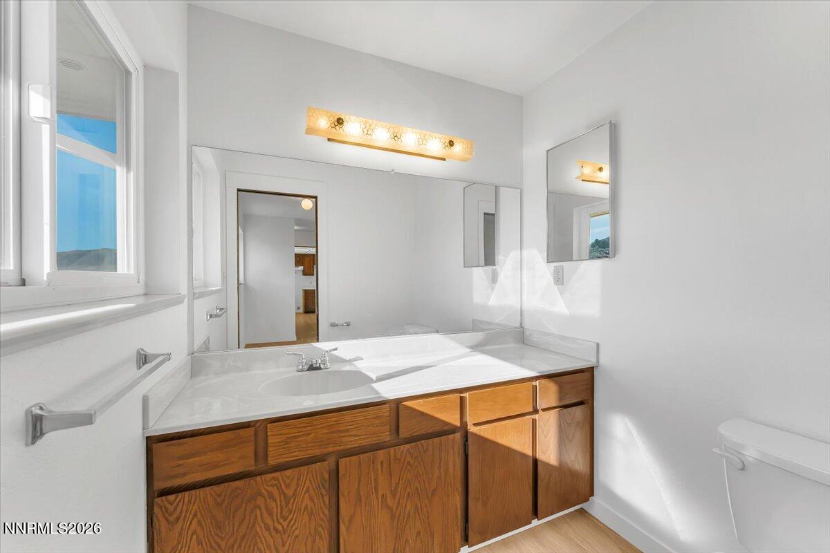 1220 Mineral Flat Road Reno, NV 89506 - Photo 15 of 50 a bathroom with a sink and a mirror