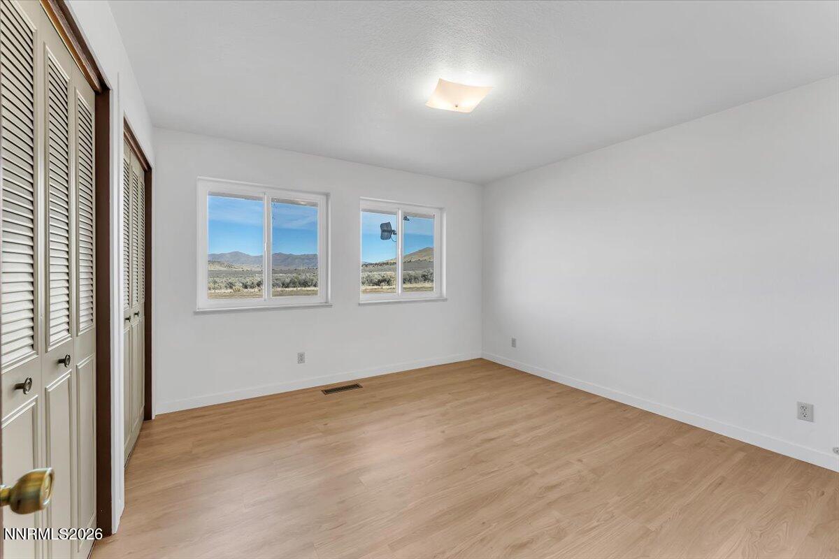 1220 Mineral Flat Road Reno, NV 89506 - Photo 17 of 50 an empty room with windows