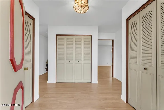 a view of an entryway with wooden floor