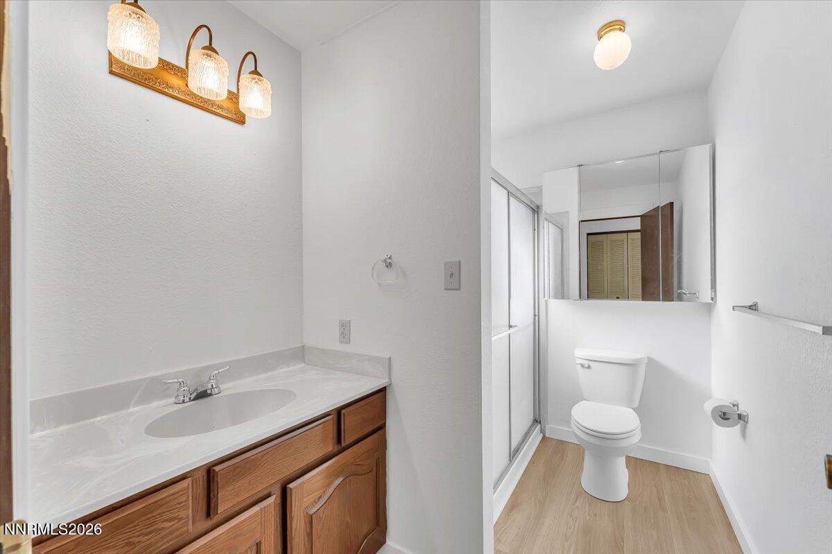 1220 Mineral Flat Road Reno, NV 89506 - Photo 23 of 50 a bathroom with a sink and a toilet