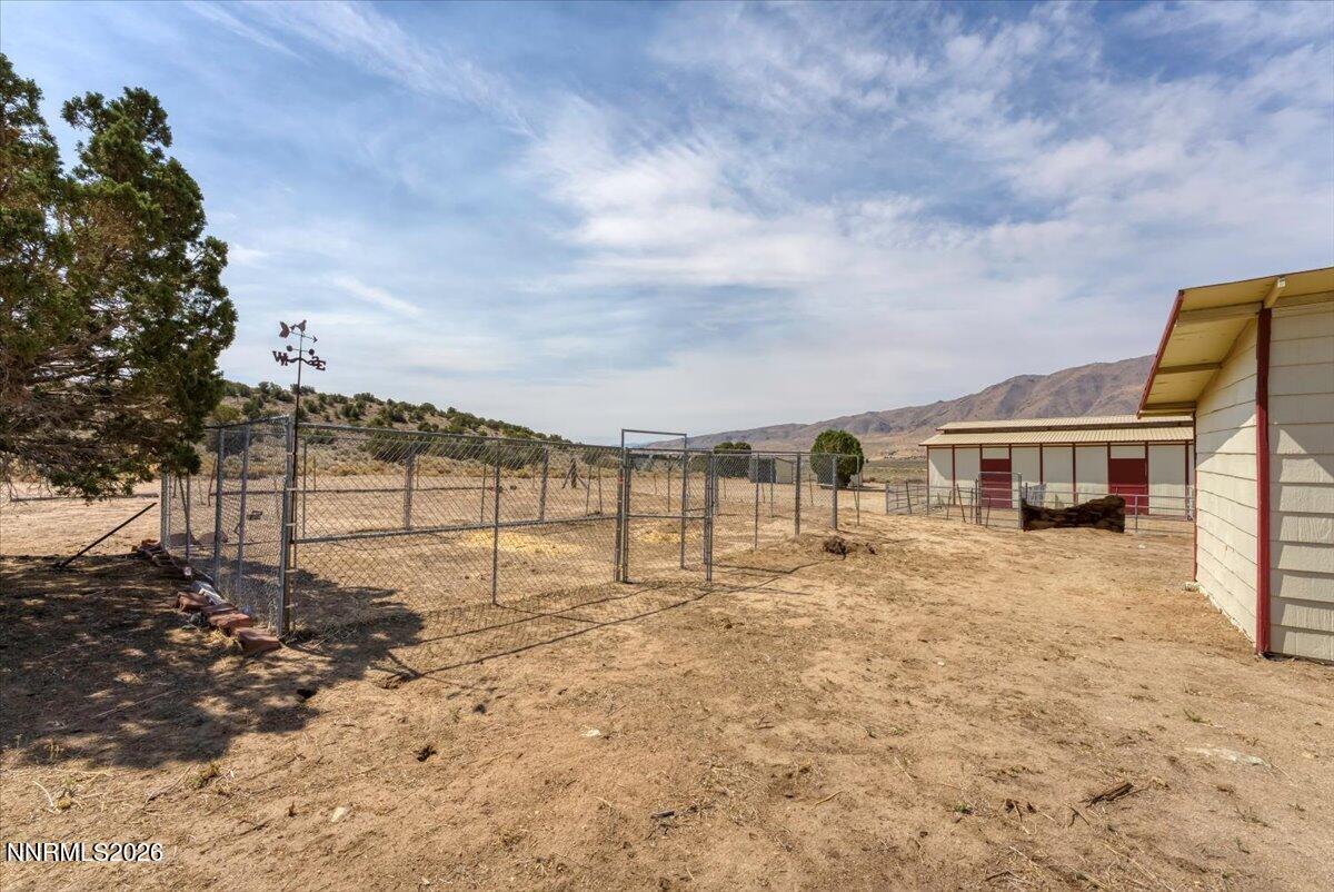 1220 Mineral Flat Road Reno, NV 89506 - Photo 28 of 50 a view of a house with a yard