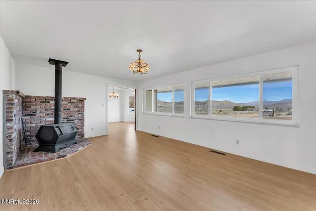 a view of a livingroom with furniture and a window
