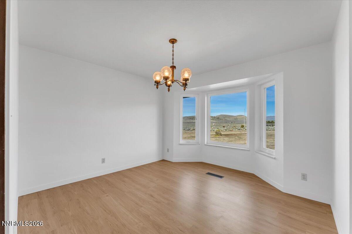 1220 Mineral Flat Road Reno, NV 89506 - Photo 5 of 50 a view of an empty room with a window