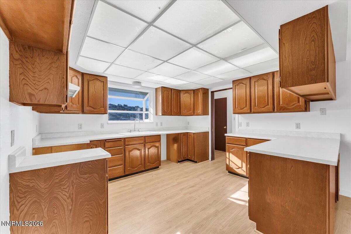 1220 Mineral Flat Road Reno, NV 89506 - Photo 9 of 50 a kitchen with stainless steel appliances granite countertop wooden cabinets a sink and dishwasher