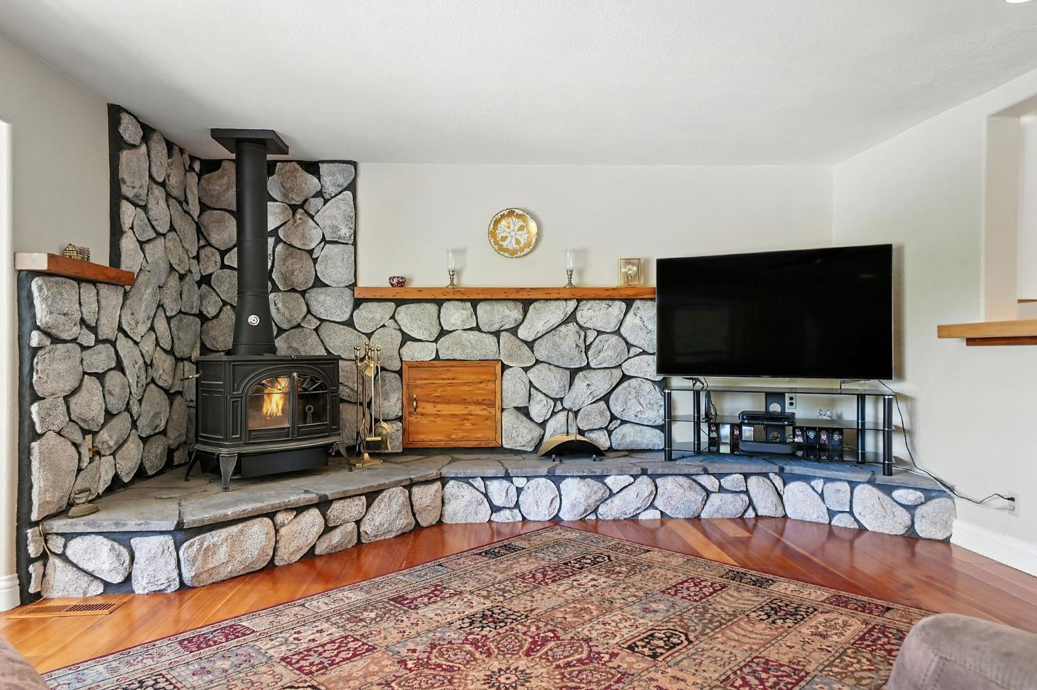17050 Rams Horn Grade Road Volcano, CA 95689 - Photo 15 of 96 a living room with furniture and a flat screen tv