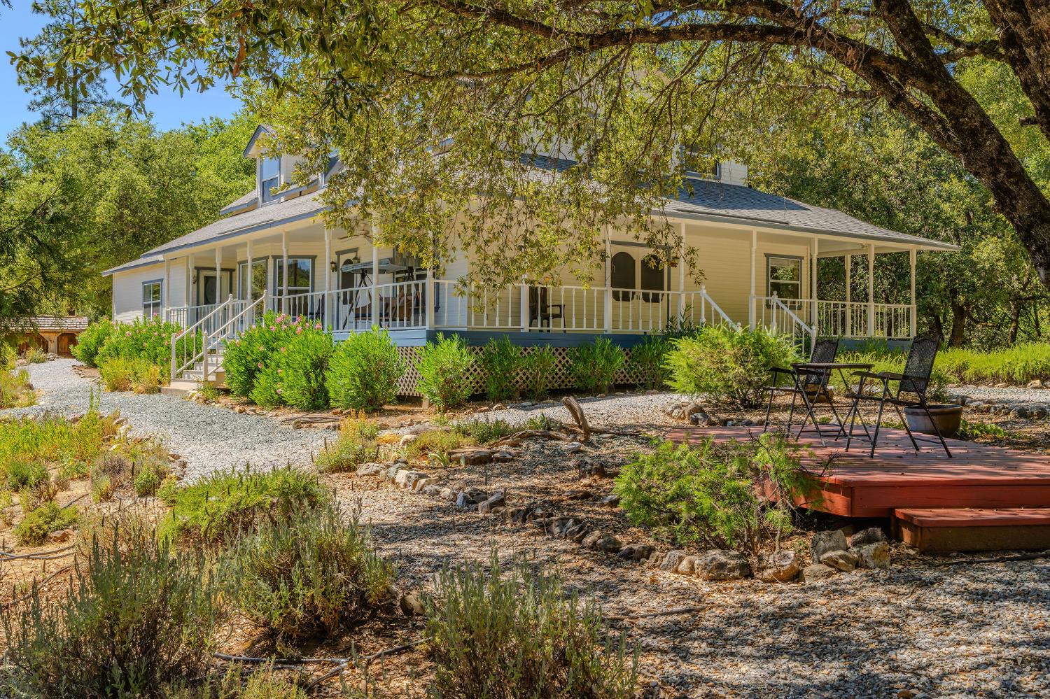17050 Rams Horn Grade Road Volcano, CA 95689 - Photo 2 of 96 a view of a house with a yard and sitting area