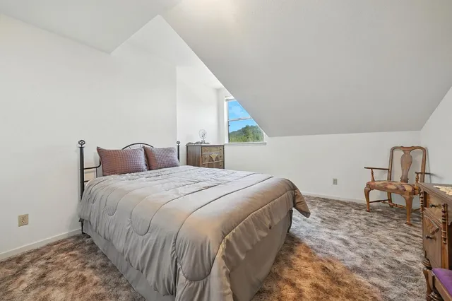 a living room with furniture and a car parked in it