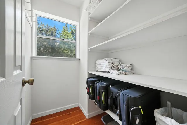 an aerial view of a house with a yard and garden