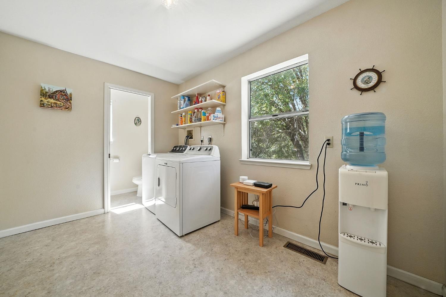 17050 Rams Horn Grade Road Volcano, CA 95689 - Photo 50 of 96 a utility room with cabinets dryer and washer