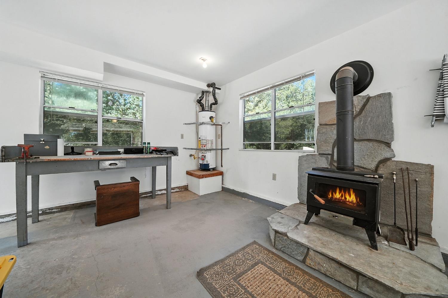 17050 Rams Horn Grade Road Volcano, CA 95689 - Photo 64 of 96 a living room with furniture and a fireplace