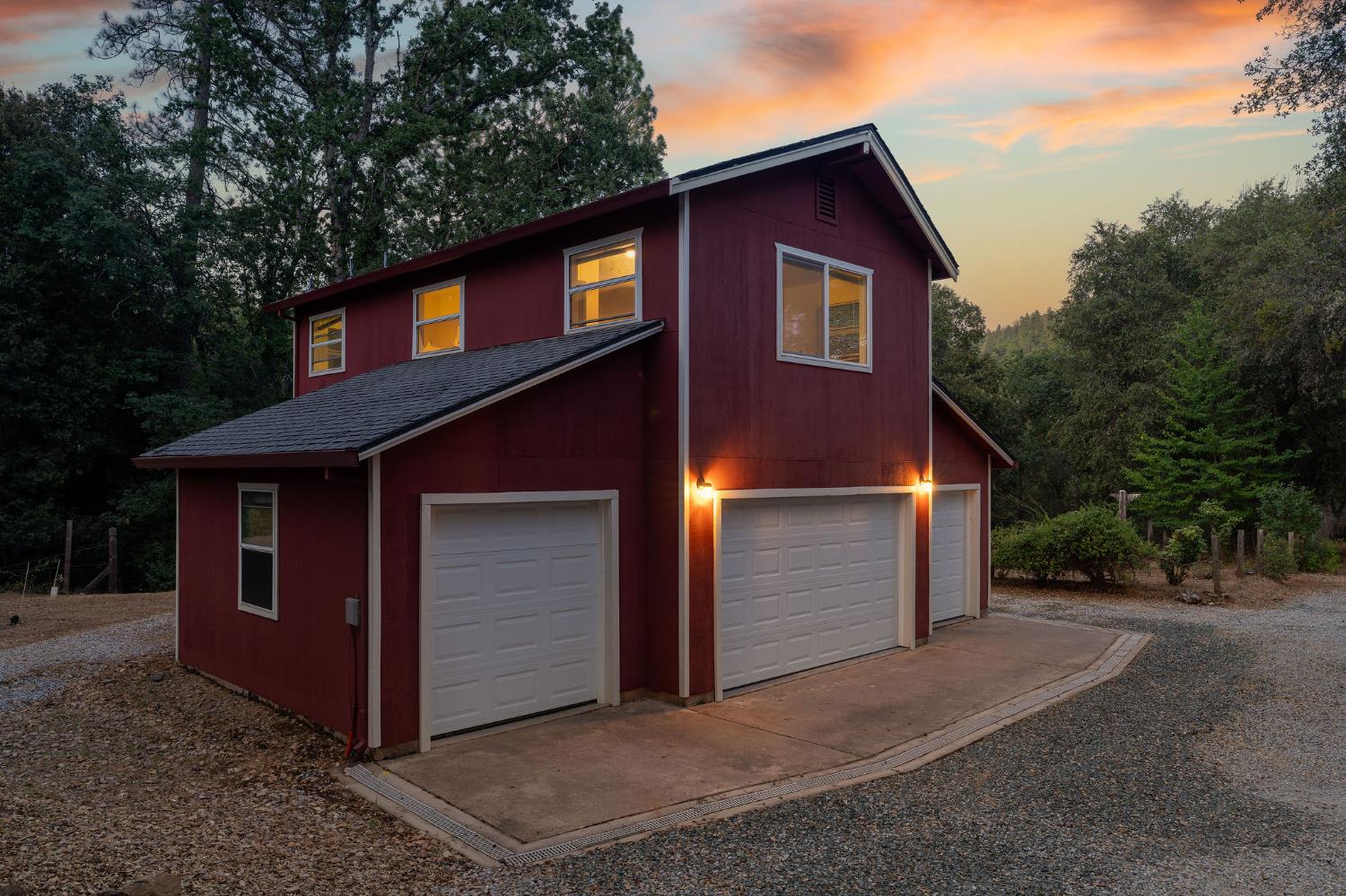 17050 Rams Horn Grade Road Volcano, CA 95689 - Photo 8 of 96 a front view of a house with a yard and garage