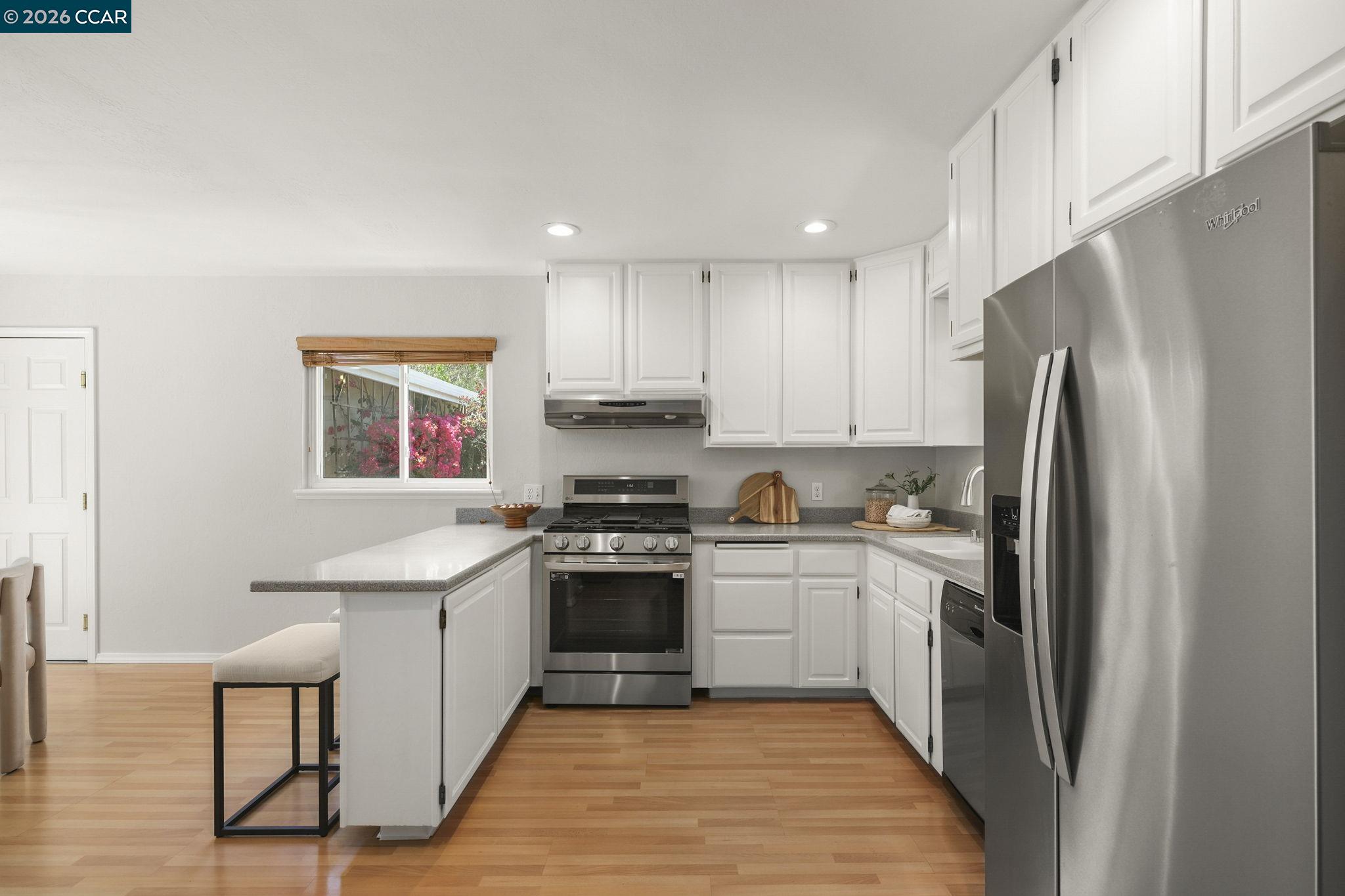 4311 Cowell Road Concord, CA 94521 - Photo 11 of 29 a kitchen with stainless steel appliances granite countertop a refrigerator sink and stove