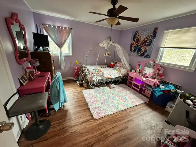 a bedroom with furniture and a window