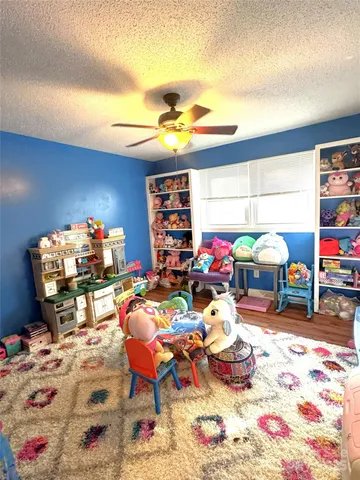 a reading room with furniture and a chandelier