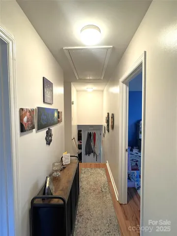 a living room with furniture and a lamp