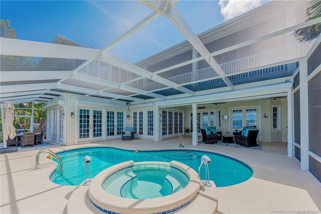 1455 Southeast Riverside Drive Stuart, FL 34996 - Photo 69 of 100 Tons of entertaining space in covered and screened areas of the patio