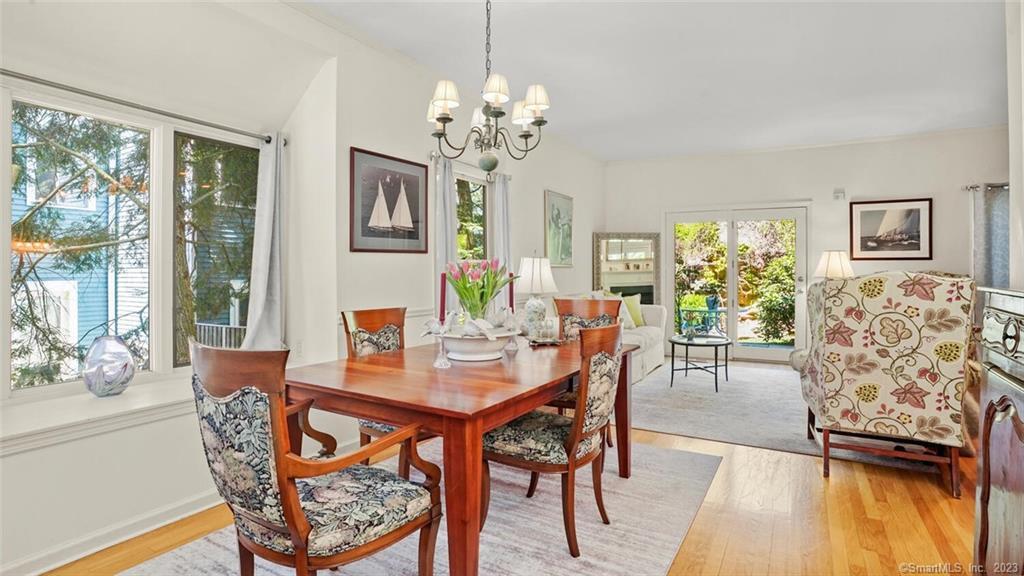 3 B Ludlow Road, Unit B Westport, CT 06880 - Photo 1 of 1 a dining room with furniture a large window and wooden floor