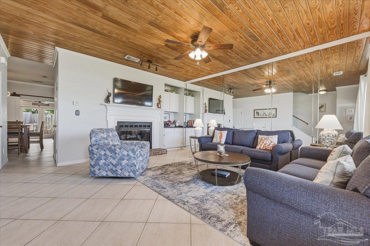 26063 Canal Road, Unit 3F Orange Beach, AL 36561 - Photo 17 of 72 a living room with furniture and a fireplace