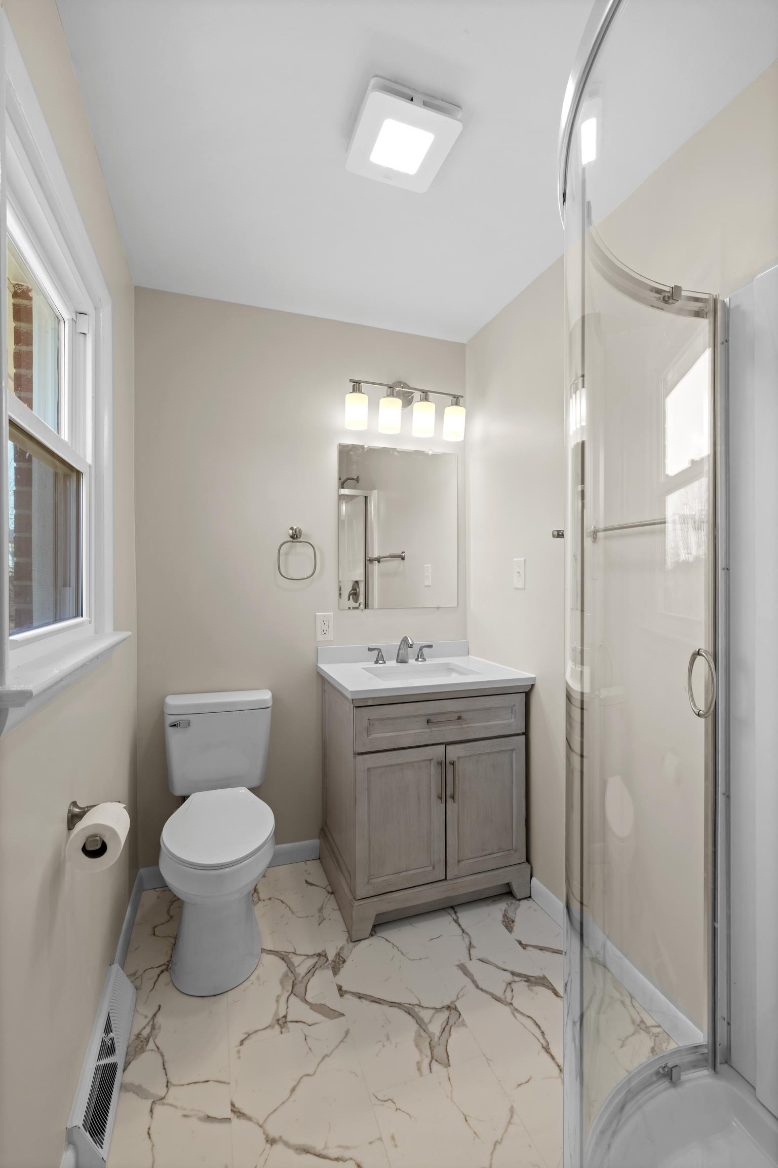 1726 Mountain Valley Road Keezletown, VA 22832 - Photo 25 of 63 a bathroom with a sink toilet and shower