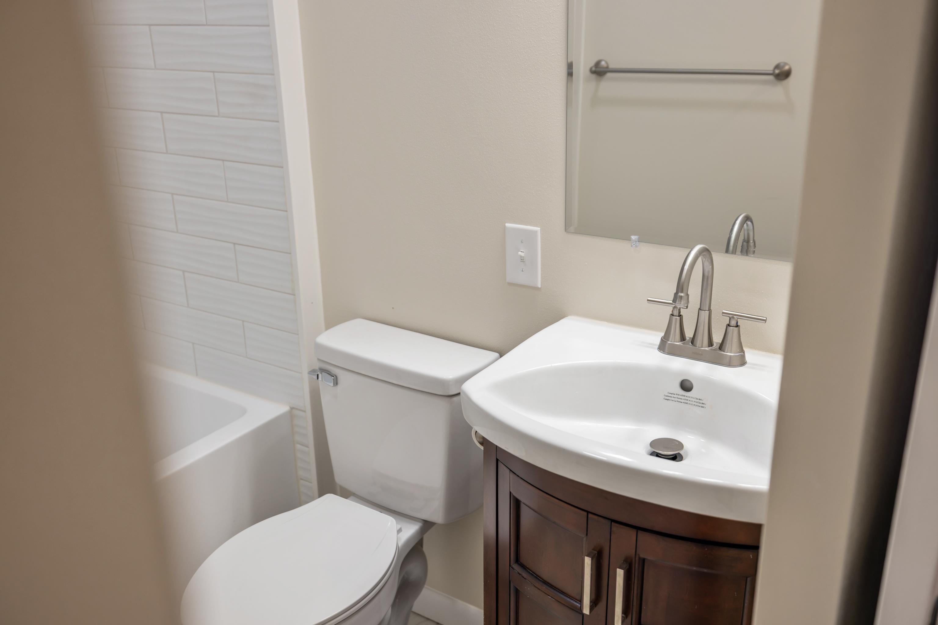 1726 Mountain Valley Road Keezletown, VA 22832 - Photo 32 of 63 a bathroom with a sink a toilet and shower