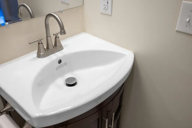 a view of a large house with a big yard and large trees