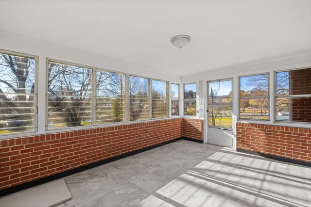 a view of an ocean with a house in the background