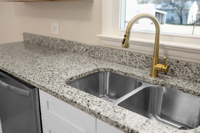 a kitchen with a refrigerator sink and microwave