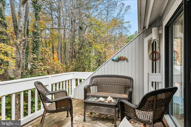 a view of a chair and table in the balcony