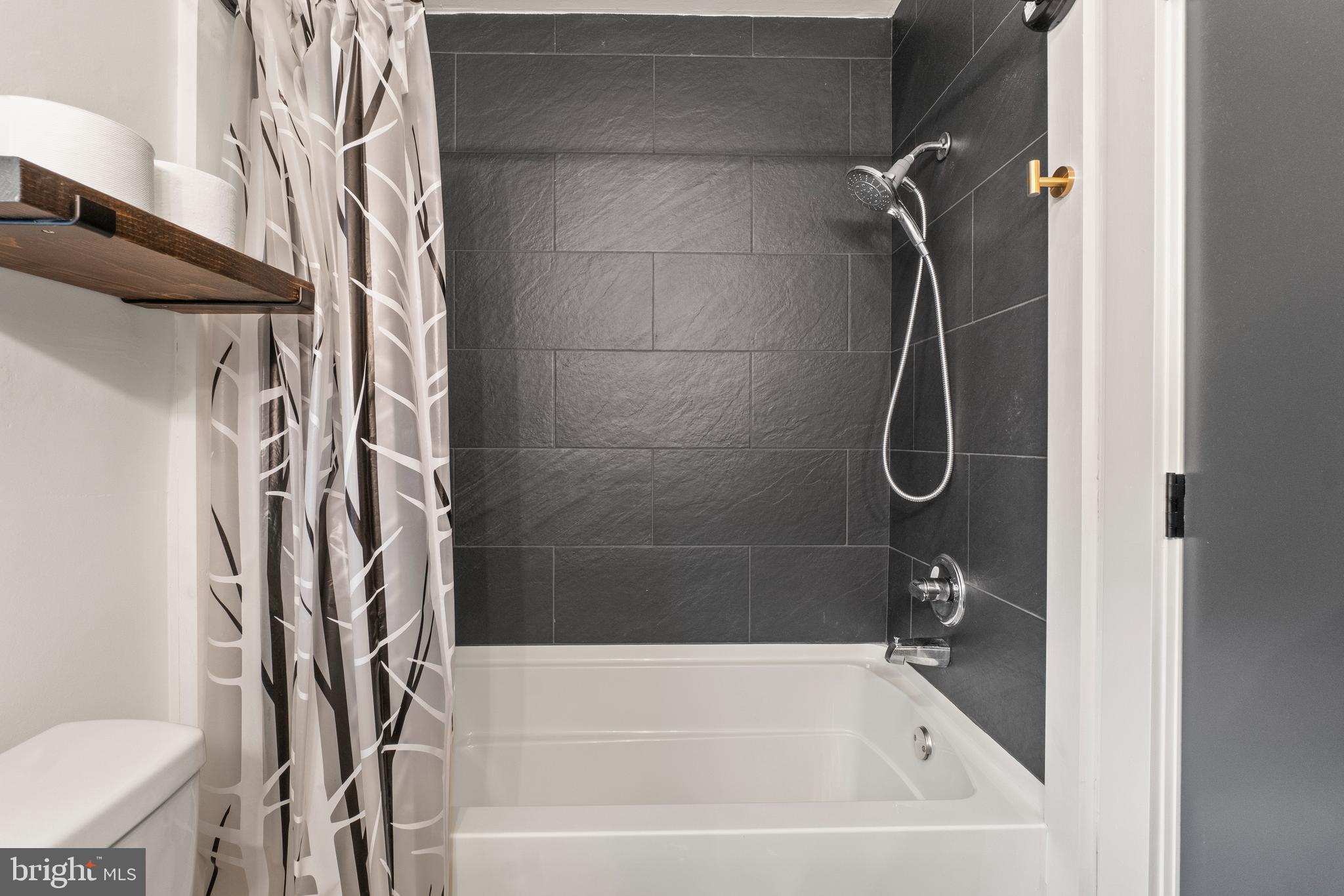 49 Sullivan Road Westminster, MD 21157 - Photo 14 of 22 Tub Shower With Ceramic Tile Surround
