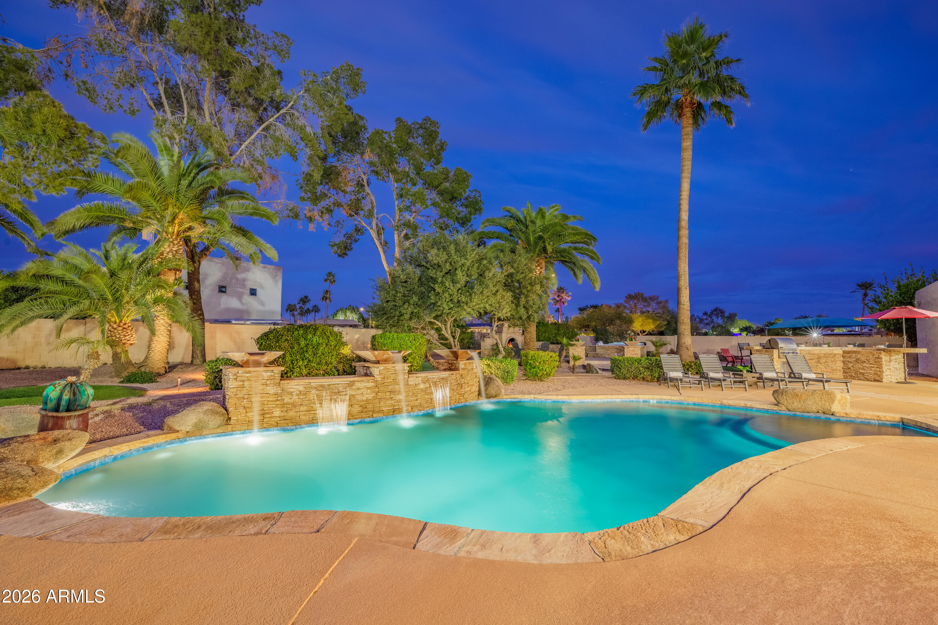 6932 East Presidio Road Scottsdale, AZ 85254 - Photo 2 of 30 a view of a swimming pool with a yard and sitting area
