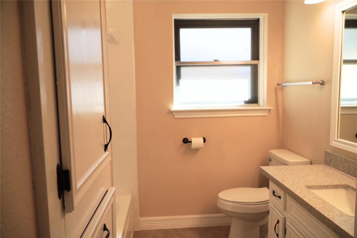 25314 Hickory Valley Lane Spring, TX 77373 - Photo 26 of 33 a bathroom with a granite countertop sink toilet and shower