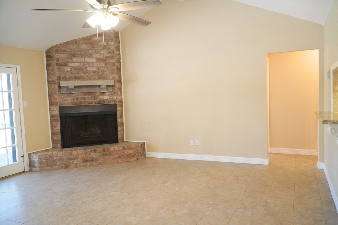 25314 Hickory Valley Lane Spring, TX 77373 - Photo 6 of 33 an empty room with windows and fireplace
