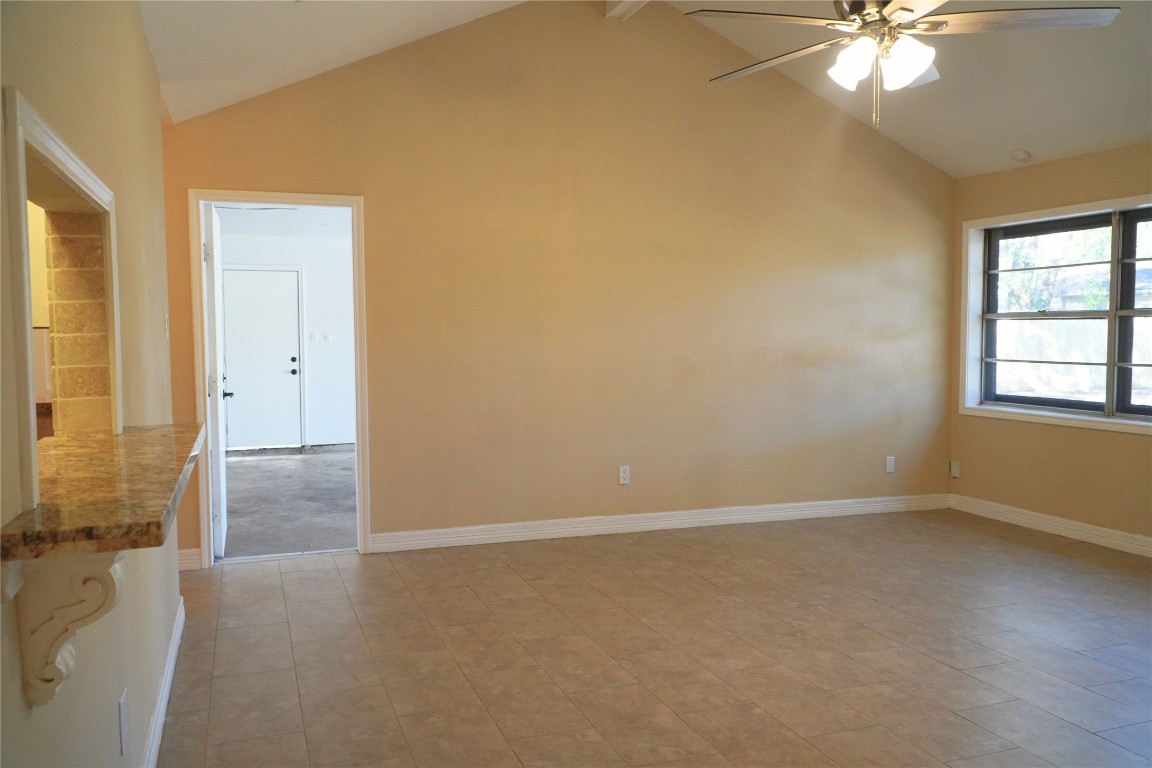 25314 Hickory Valley Lane Spring, TX 77373 - Photo 7 of 33 an empty room with chandelier fan and windows