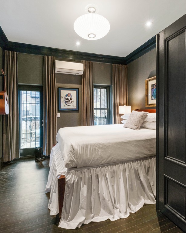 15 East Springfield Street, Unit 2 Boston, MA 02118 - Photo 11 of 17 a bed sitting in a spacious bedroom next to a window