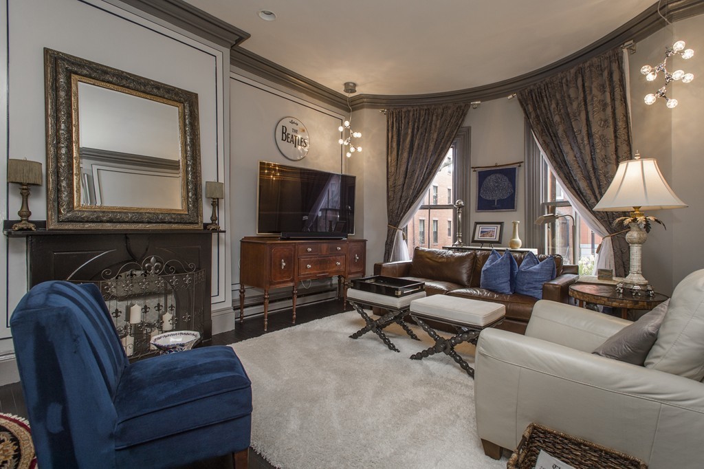 15 East Springfield Street, Unit 2 Boston, MA 02118 - Photo 2 of 17 a living room with furniture and a flat screen tv