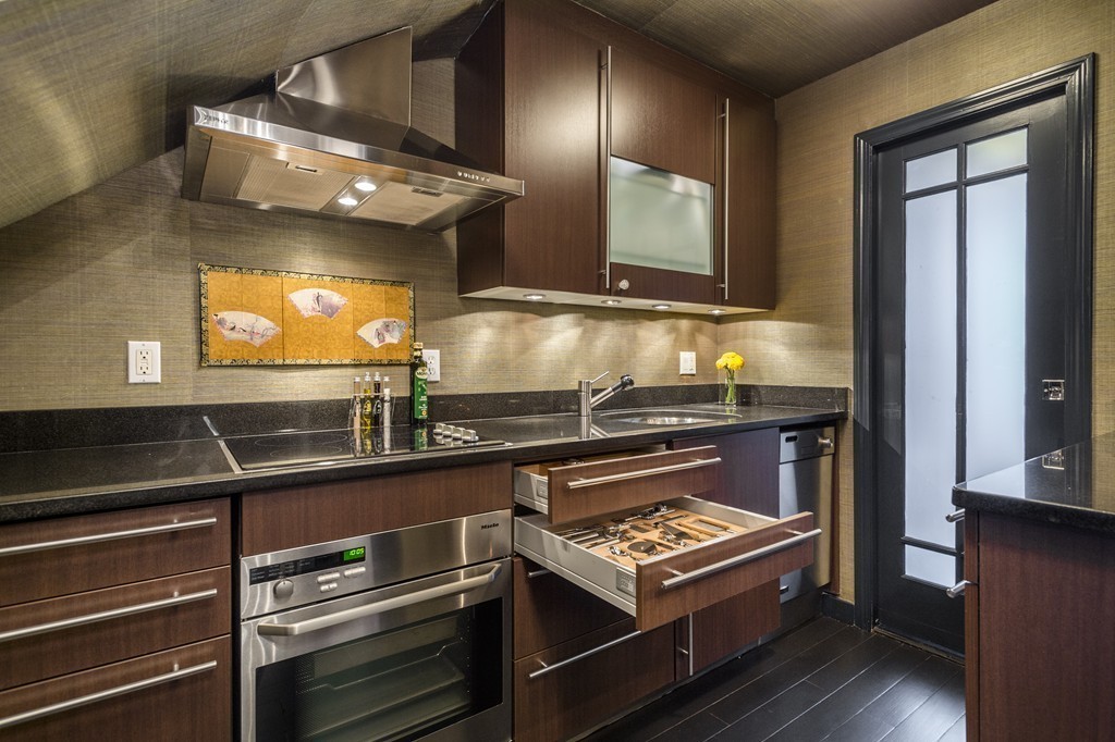 15 East Springfield Street, Unit 2 Boston, MA 02118 - Photo 5 of 17 a kitchen with stainless steel appliances granite countertop a stove and a microwave