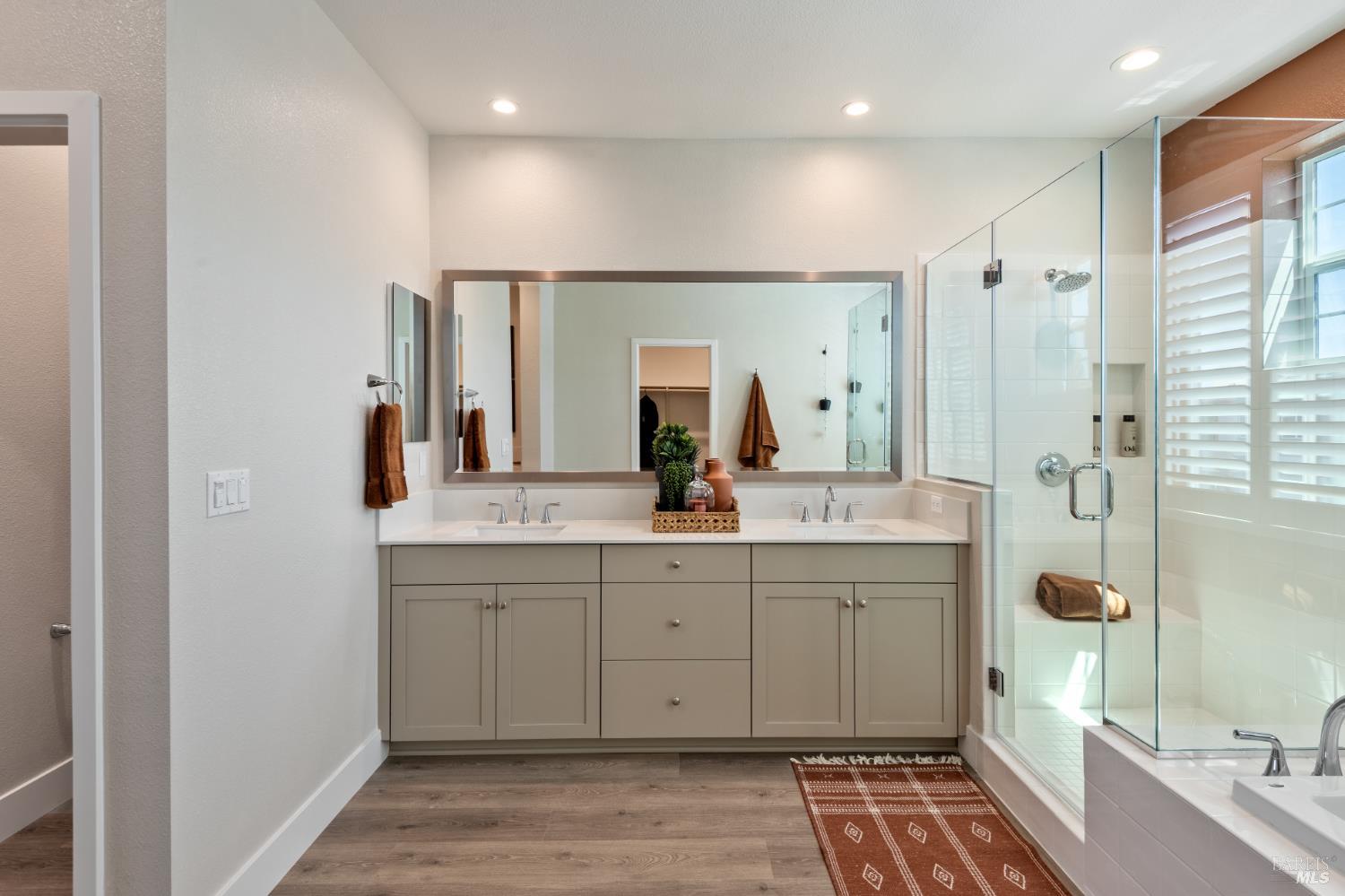2534 Courtney Avenue Santa Rosa, CA 95403 - Photo 5 of 17 a spacious bathroom with a double vanity sink a mirror and shower