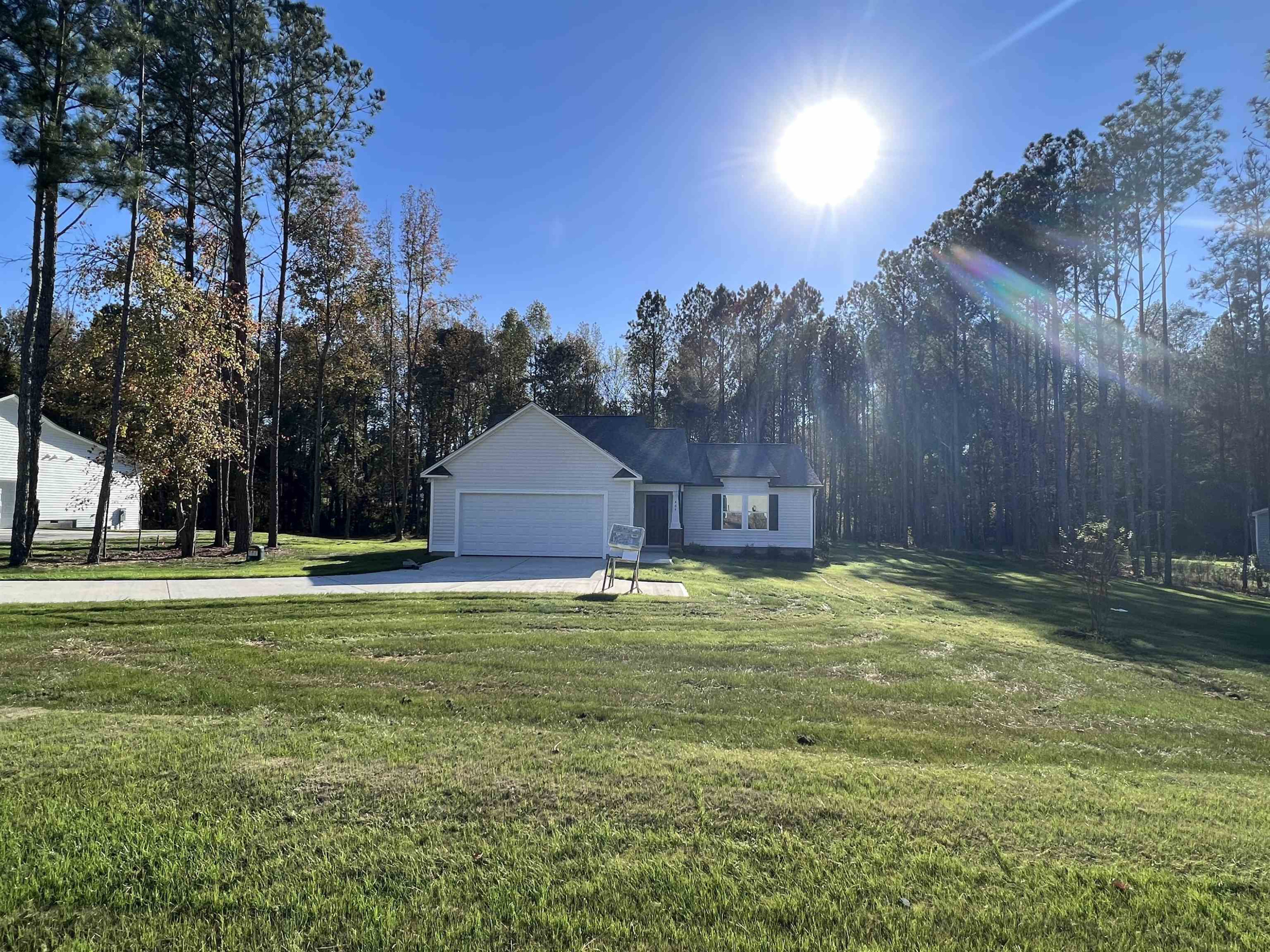 464 Roberts Road Willow Spring, NC 27592 - Photo 2 of 16 a backyard of a house