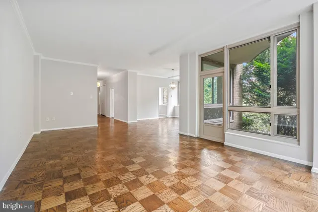 a view of an empty room with a window