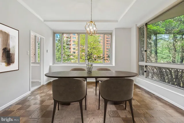 a view of a dining room with furniture window and outside view