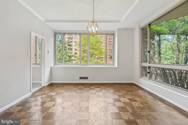 a view of an empty room with a window