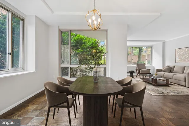 a white bench sitting in a backyard of a house